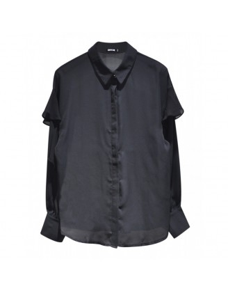 Black shirt with ruffles on the sleeves